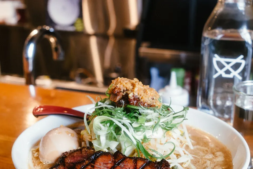 A bowl of tonkotsu ramen with pork and a halved egg, similar to what Ichiran serves, and not taken at the restaurant