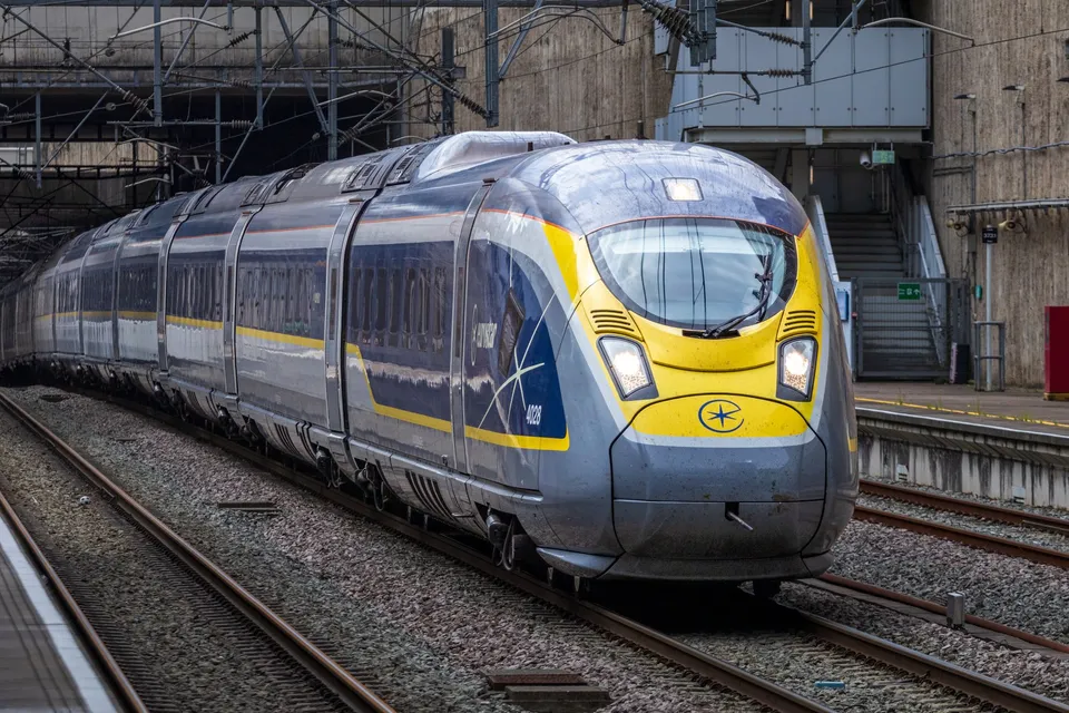 A Eurostar train arriving at a station platform