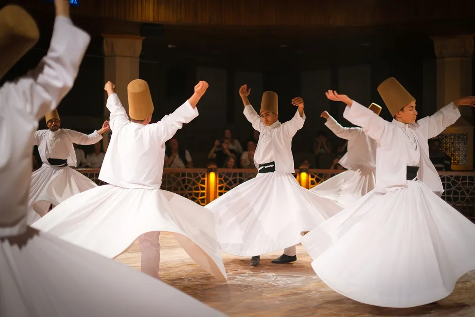 Whirling dervishes turning in a sema ceremony in Konya